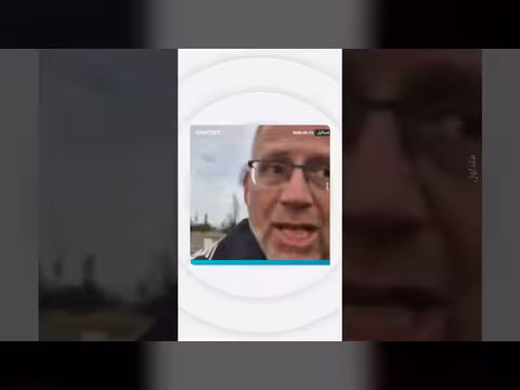 شرطي إسرائيلي يمنع توثيق حريق بعد ضربة إيرانية